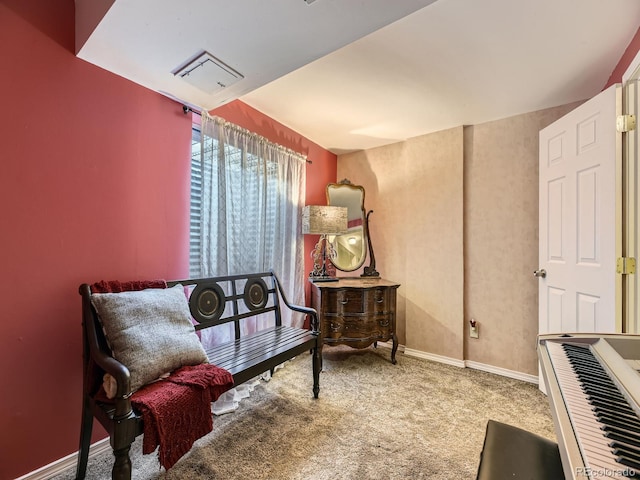 living area with carpet and baseboards