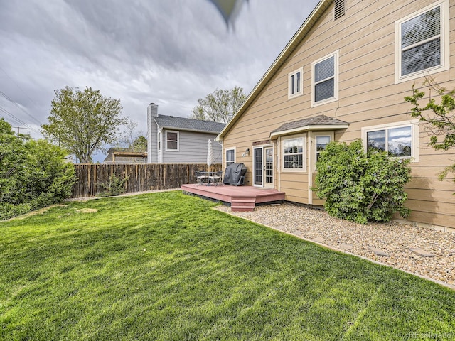 back of house featuring a wooden deck
