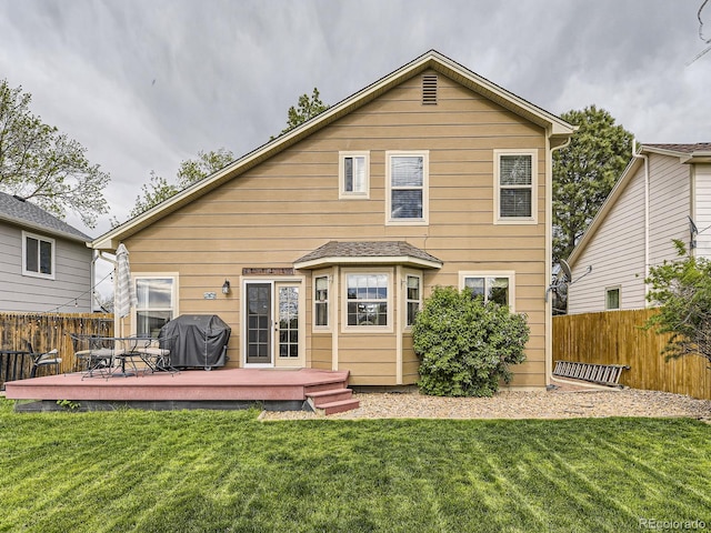 back of house with a wooden deck