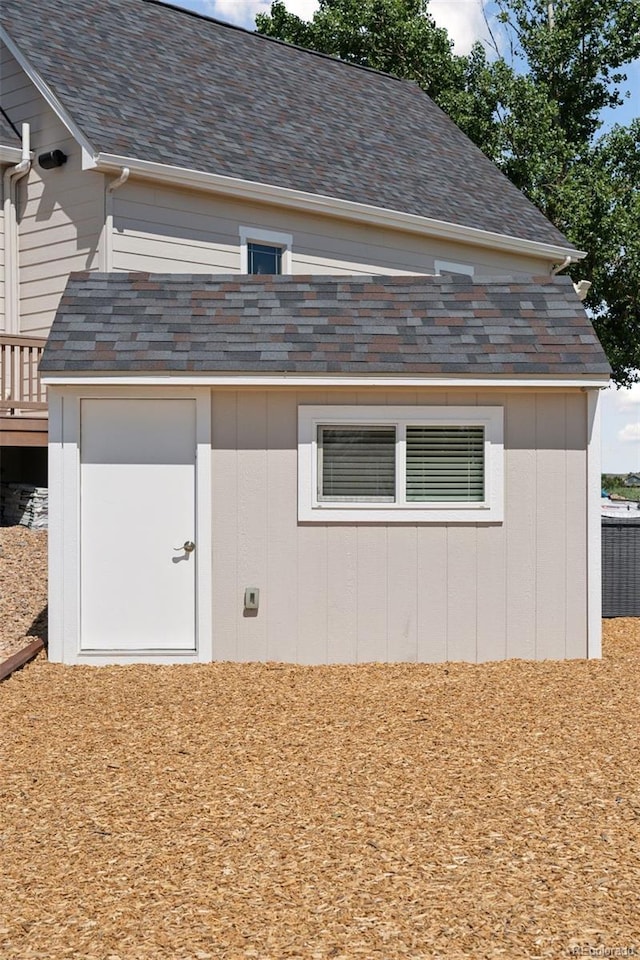 3048 Deer Creek Ranch Loop, Parker, CO 80138 - view of side of property featuring a shingled roof and a storage unit
