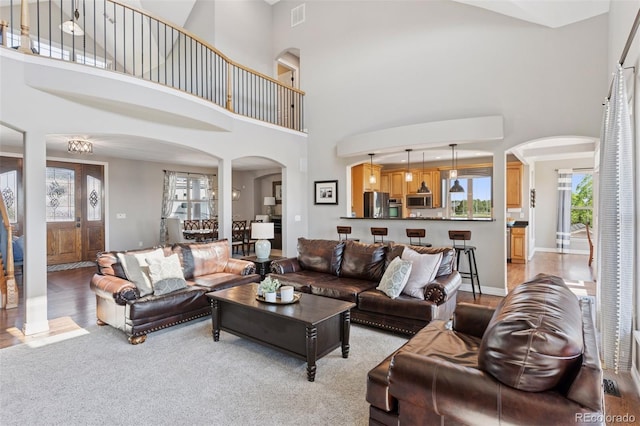 3048 Deer Creek Ranch Loop, Parker, CO 80138 - living room with arched walkways and a high ceiling