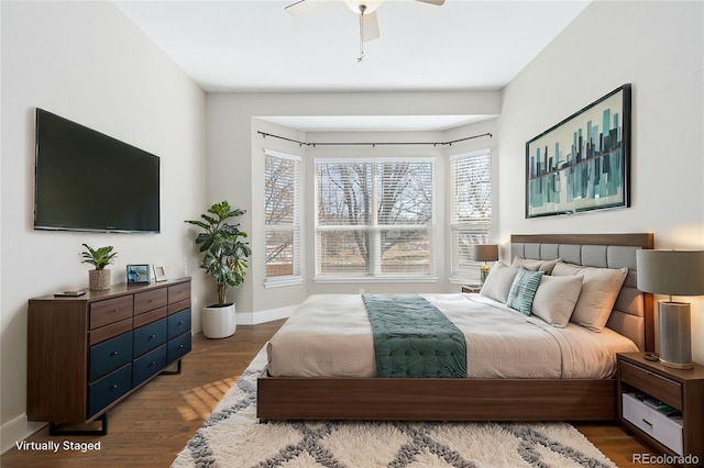 bedroom with hardwood / wood-style flooring and ceiling fan