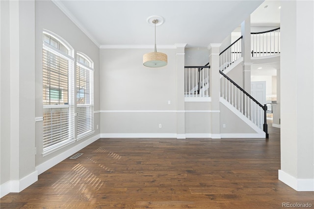 interior space with ornamental molding and dark hardwood / wood-style floors