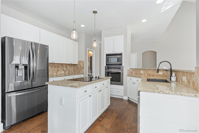 kitchen featuring white cabinetry, sink, stainless steel appliances, and kitchen peninsula