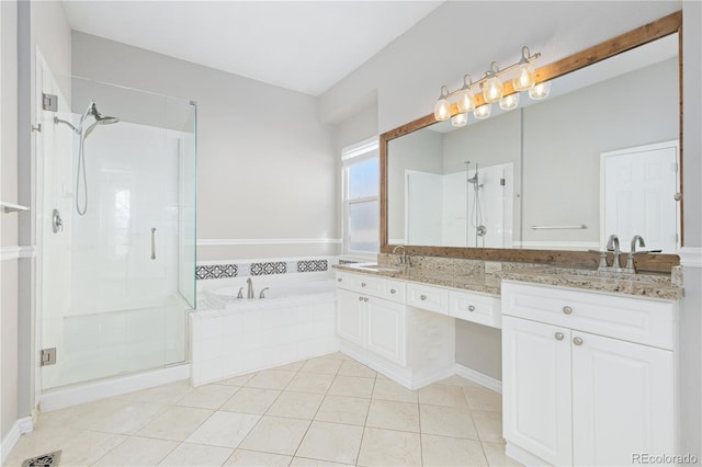 bathroom featuring vanity, independent shower and bath, and tile patterned flooring