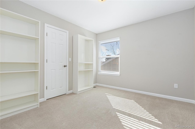 unfurnished bedroom featuring light colored carpet