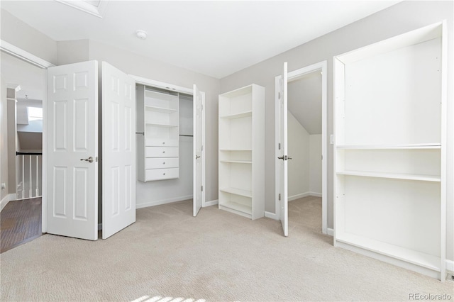 unfurnished bedroom with light colored carpet