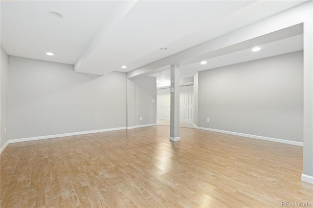 basement with light hardwood / wood-style floors