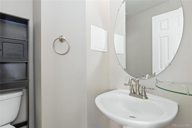 bathroom with sink and toilet