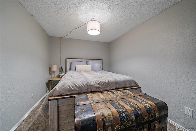 unfurnished bedroom with a textured ceiling and carpet