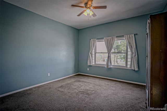 carpeted empty room featuring ceiling fan