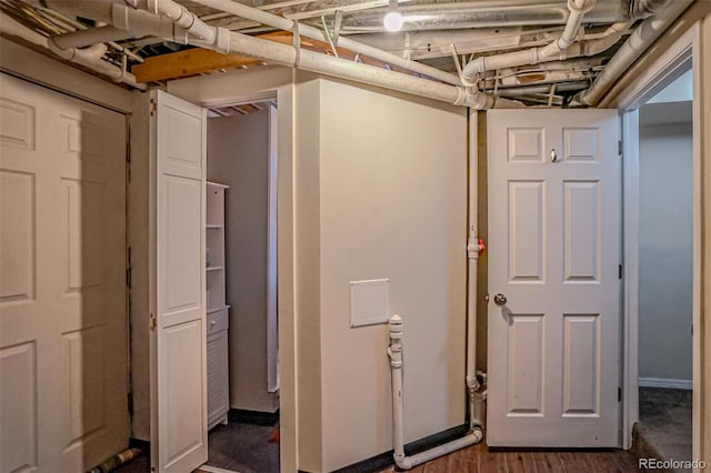 basement featuring dark hardwood / wood-style floors