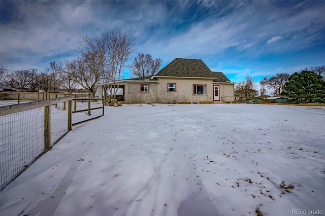 view of snow covered house