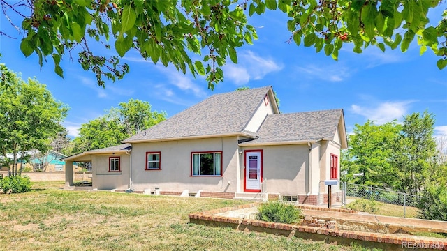 1205 N Linden Ave, Trinidad, CO 81082 - view of front of property featuring stucco siding, a fenced backyard, and a shingled roof