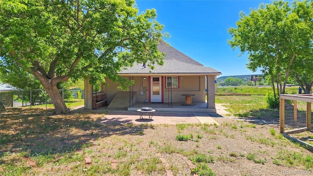 1205 N Linden Ave, Trinidad, CO 81082 - rear view of house with a patio and a shingled roof