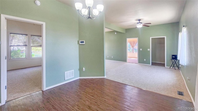 1205 N Linden Ave, Trinidad, CO 81082 - spare room featuring carpet flooring, wood finished floors, a chandelier, a ceiling fan, and a smoke detector