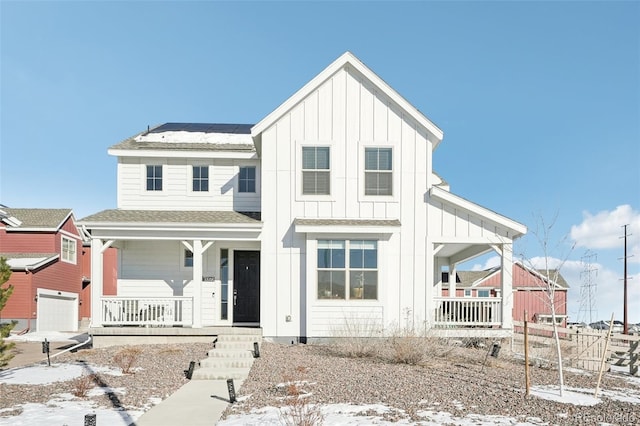 modern farmhouse with a garage and covered porch