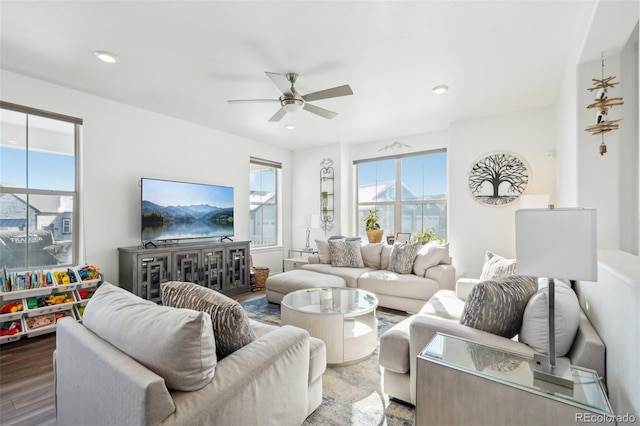 living room with hardwood / wood-style floors and ceiling fan