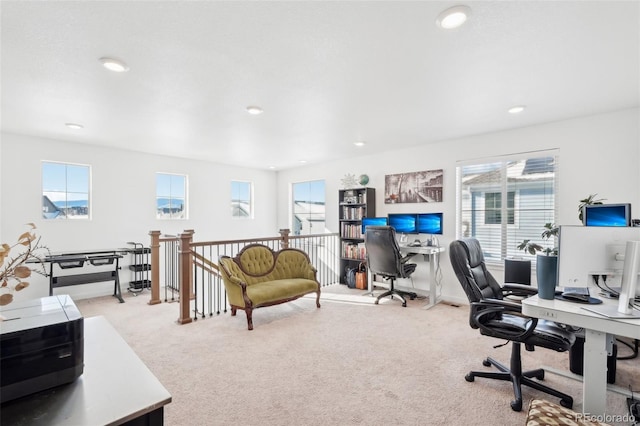 home office featuring a healthy amount of sunlight and light colored carpet