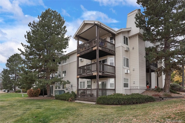 exterior space featuring a lawn and a deck