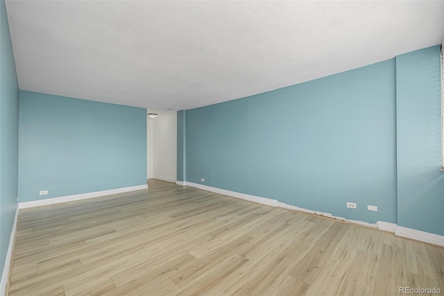1196 N Grant St Unit 705, Denver, CO 80203 - spare room featuring wood finished floors and baseboards