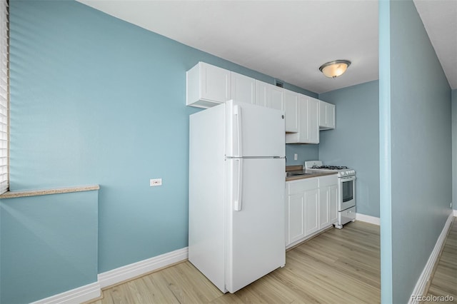 1196 N Grant St Unit 705, Denver, CO 80203 - kitchen featuring white appliances, light wood finished floors, baseboards, white cabinets, and a sink