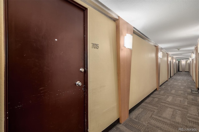 1196 N Grant St Unit 705, Denver, CO 80203 - hallway featuring carpet flooring and baseboards