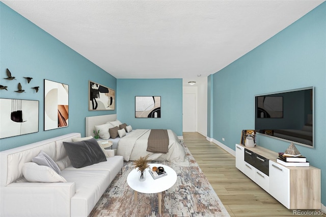 1196 N Grant St Unit 705, Denver, CO 80203 - living area with light wood-type flooring and baseboards