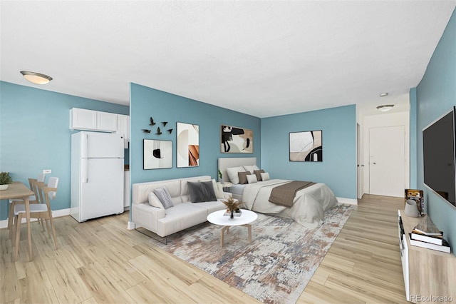 1196 N Grant St Unit 705, Denver, CO 80203 - living area featuring light wood-style flooring and baseboards