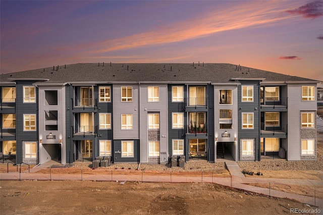 view of outdoor building at dusk