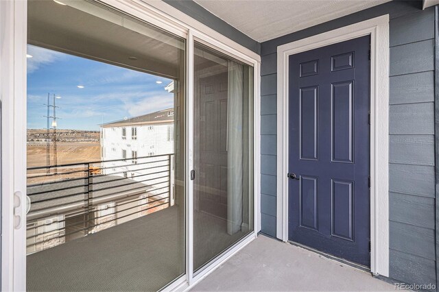 doorway to property with a balcony