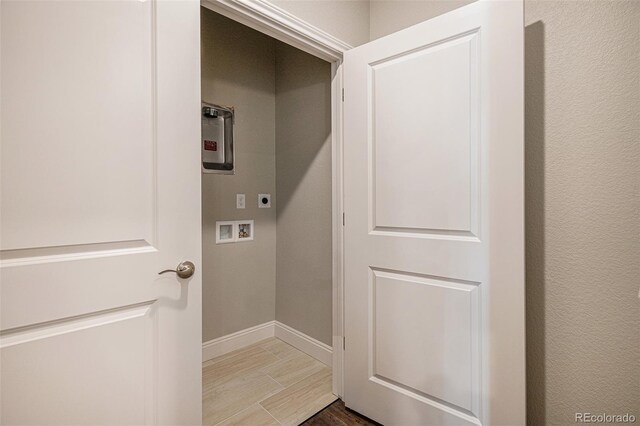 laundry room featuring washer hookup, hardwood / wood-style floors, and hookup for an electric dryer