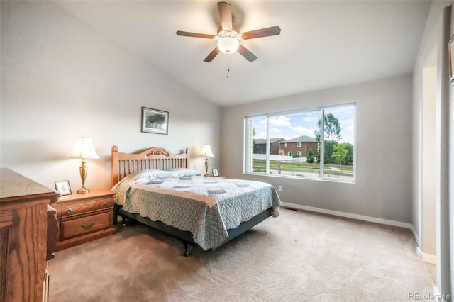 6015 Trappers Tale Ct, Colorado Springs, CO 80923 - bedroom with light carpet, vaulted ceiling, baseboards, and a ceiling fan