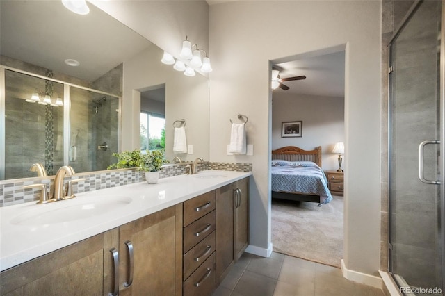 6015 Trappers Tale Ct, Colorado Springs, CO 80923 - bathroom with ceiling fan, double vanity, ensuite bathroom, a shower stall, and tile patterned flooring