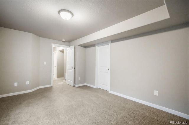 6015 Trappers Tale Ct, Colorado Springs, CO 80923 - carpeted empty room with baseboards and a textured ceiling