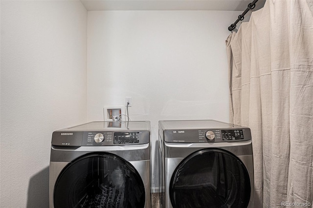 clothes washing area with laundry area and washing machine and dryer