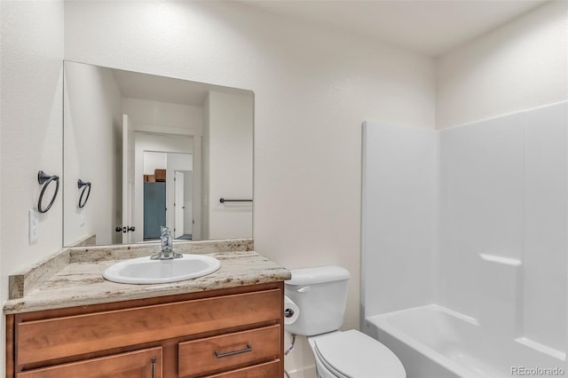 bathroom with toilet and vanity