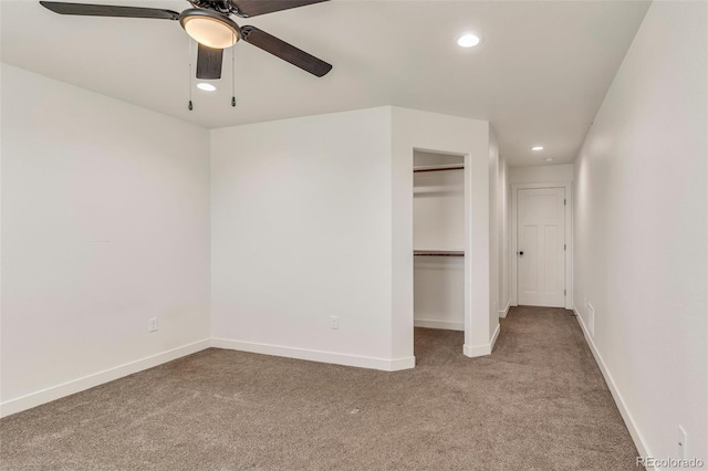 unfurnished bedroom with baseboards, a closet, carpet, and recessed lighting