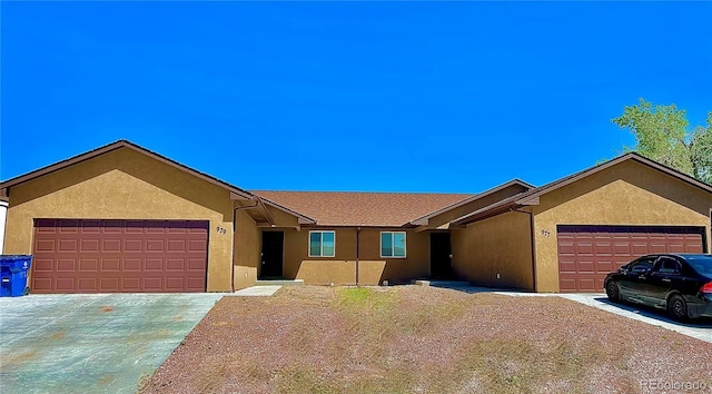 977 S Harmony Dr Unit 979, Pueblo, CO 81007 - ranch-style home with a garage, driveway, and stucco siding