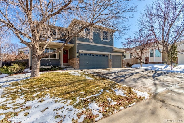 view of front of property with a garage and a lawn