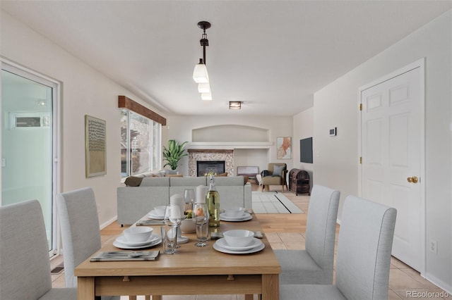 dining area with built in features and light tile patterned floors