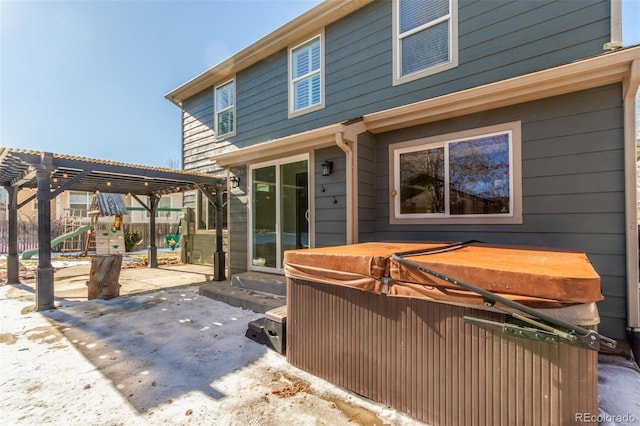 rear view of house featuring a playground, a patio, and a pergola