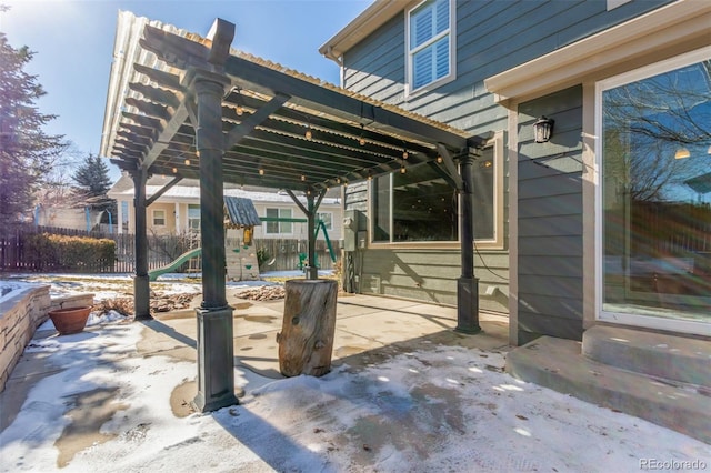 view of patio / terrace featuring a pergola and a playground