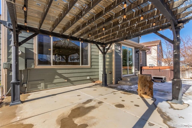 view of patio with a pergola and a hot tub