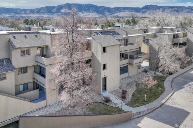 view of property featuring a mountain view and a residential view