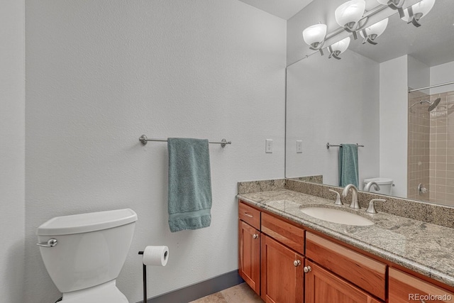 full bath with vanity, an inviting chandelier, toilet, and a shower