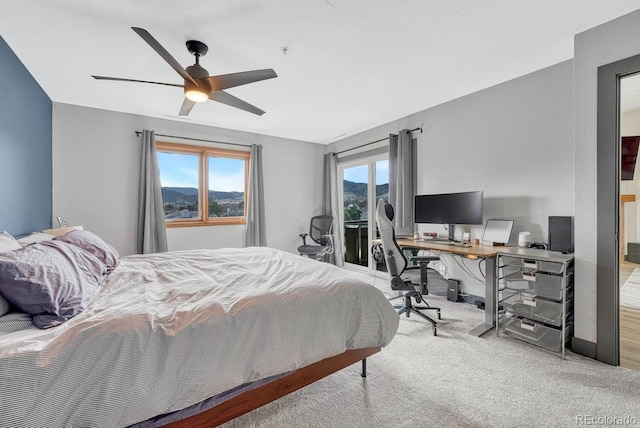 bedroom featuring access to exterior, ceiling fan, and carpet floors