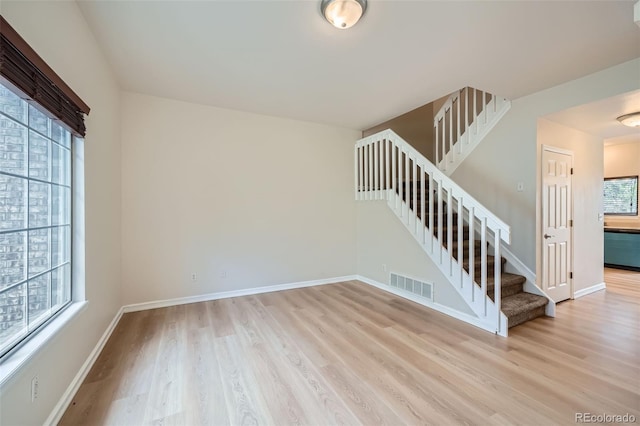 3033 W 107th Pl Unit D, Westminster, CO 80031 - interior space with visible vents, baseboards, light wood-style floors, and stairs
