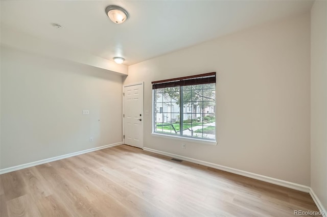 3033 W 107th Pl Unit D, Westminster, CO 80031 - spare room featuring light wood-style floors, baseboards, and visible vents