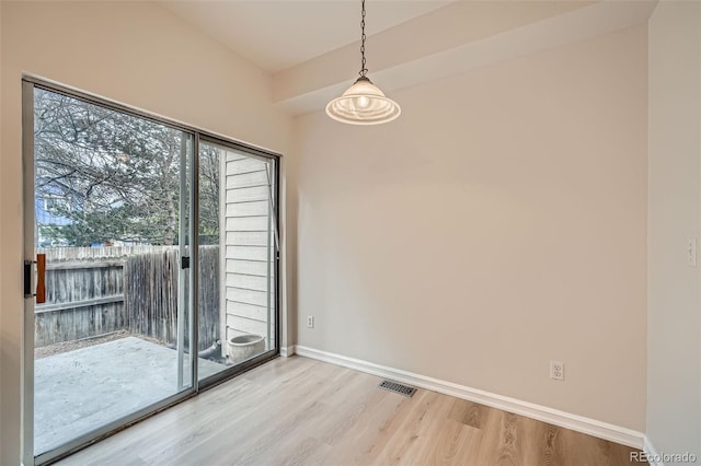 3033 W 107th Pl Unit D, Westminster, CO 80031 - unfurnished dining area with visible vents, light wood-style floors, and baseboards